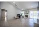 Open living space with a brick fireplace, large windows, and a view into other rooms at 1553 Bright View Dr, Las Vegas, NV 89119