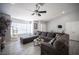 Inviting living room with comfortable sectional, bright windows, and contemporary furnishings at 1553 Bright View Dr, Las Vegas, NV 89119
