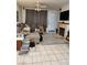 Comfortable living room area complete with a fireplace, tile floors, and glass patio doors at 1617 Stonefield St, Las Vegas, NV 89144