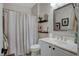 Bright bathroom featuring a white vanity, framed art, and tub-shower combo at 169 Pioneer Peak Pl, Las Vegas, NV 89138