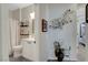 Neutral bathroom with white vanity, decorative shelves, and framed art at 169 Pioneer Peak Pl, Las Vegas, NV 89138