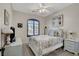 Comfortable bedroom featuring a queen bed, neutral walls, and natural lighting at 169 Pioneer Peak Pl, Las Vegas, NV 89138