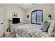 Cozy bedroom with a large shuttered window and a charming blue painted dresser at 169 Pioneer Peak Pl, Las Vegas, NV 89138