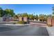 Community entrance gates with stone pillars and manicured landscaping at 169 Pioneer Peak Pl, Las Vegas, NV 89138
