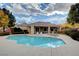 Community pool and sun deck, featuring lounge chairs and umbrellas at 169 Pioneer Peak Pl, Las Vegas, NV 89138