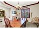 Dining room featuring a beautiful wood table, decorative walls, and chandelier at 169 Pioneer Peak Pl, Las Vegas, NV 89138