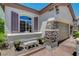 This house features stone accents, window shutters, and well-manicured yard at 169 Pioneer Peak Pl, Las Vegas, NV 89138
