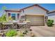 Charming single story home with stone accents and well-maintained landscaping at 169 Pioneer Peak Pl, Las Vegas, NV 89138
