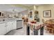Bright kitchen with breakfast table, center island, and view of the living room at 169 Pioneer Peak Pl, Las Vegas, NV 89138