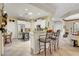 Eat-in kitchen with stainless steel appliances and breakfast bar looking into dining room at 169 Pioneer Peak Pl, Las Vegas, NV 89138