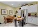 Eat-in kitchen with stainless steel appliances, white cabinets, and center island at 169 Pioneer Peak Pl, Las Vegas, NV 89138