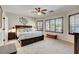 Serene main bedroom features a ceiling fan, large windows, and a spacious layout at 169 Pioneer Peak Pl, Las Vegas, NV 89138