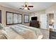 Inviting main bedroom with ample natural light and a glimpse of the en-suite bathroom at 169 Pioneer Peak Pl, Las Vegas, NV 89138