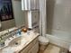 Bathroom featuring granite countertop, white cabinets, and bathtub with shower at 1866 Camino Verde Ln, Las Vegas, NV 89119
