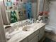 A cute decorated bathroom with marble countertop and tile flooring at 1866 Camino Verde Ln, Las Vegas, NV 89119