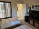 Cozy bedroom with two twin beds, natural light, and functional storage at 1866 Camino Verde Ln, Las Vegas, NV 89119