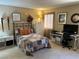 Comfortable bedroom with a cozy bed, side tables, and a workspace bathed in natural light at 1866 Camino Verde Ln, Las Vegas, NV 89119