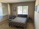 Bright bedroom with a window and an office chair at 1866 Camino Verde Ln, Las Vegas, NV 89119