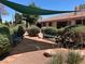 Tranquil outdoor lounge area with shade structure, perfect for relaxation and socializing at 1866 Camino Verde Ln, Las Vegas, NV 89119
