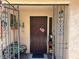Gated front porch with seating, plants and decor at 1866 Camino Verde Ln, Las Vegas, NV 89119