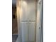 Hallway featuring plentiful white storage cabinets and tile flooring at 1866 Camino Verde Ln, Las Vegas, NV 89119