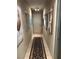 Hallway with a rug and decorative artwork at 1866 Camino Verde Ln, Las Vegas, NV 89119