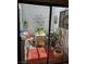 Charming patio featuring decor, small table, chairs and plants at 1866 Camino Verde Ln, Las Vegas, NV 89119