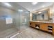 Elegant bathroom with large shower, double vanity, marble countertop, and detailed gold mirror at 2000 N Fashion Show Dr # 5417, Las Vegas, NV 89109