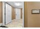 Condo hallway featuring doors, neutral decor, and patterned tile flooring at 2000 N Fashion Show Dr # 5417, Las Vegas, NV 89109