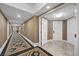 Elegant hallway with patterned carpet, neutral walls, and access to rooms with stylish doors and lighting at 2000 N Fashion Show Dr # 5417, Las Vegas, NV 89109