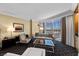 Bright living area with city views, comfortable seating, a desk and wet bar for convenient living at 2000 N Fashion Show Dr # 5417, Las Vegas, NV 89109