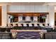 Chic bar area with a marble countertop, modern stools, and multiple TVs for entertainment and drinks at 2000 N Fashion Show Dr # 5617, Las Vegas, NV 89109