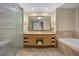 Spacious bathroom featuring a double vanity, framed mirror, and separate shower at 2000 N Fashion Show Dr # 5617, Las Vegas, NV 89109