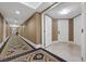 Wide hallway with decorative carpet, textured walls and multiple doors at 2000 N Fashion Show Dr # 5617, Las Vegas, NV 89109