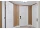 Hallway featuring textured walls, tile floors, and white doors with silver hardware at 2000 N Fashion Show Dr # 5617, Las Vegas, NV 89109