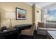 Open living room features city views, a comfortable seating area, and a dedicated workspace at 2000 N Fashion Show Dr # 5617, Las Vegas, NV 89109