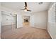 View of the bedroom showcasing carpeted floors, shutters, and an open entry to the living area at 2031 Silver St, Pahrump, NV 89048