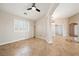 Bonus room with tile flooring, a ceiling fan, and a view of a window with plantation shutters at 2031 Silver St, Pahrump, NV 89048