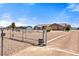 Wide lot with desert landscaping, fencing, circular driveway and mature trees at 2031 Silver St, Pahrump, NV 89048
