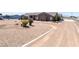 Oversized desert landscaped front yard with a long circular driveway at 2031 Silver St, Pahrump, NV 89048