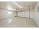 Spacious three-car garage with sealed floors and ample lighting, ready for your vehicles and storage needs at 2031 Silver St, Pahrump, NV 89048