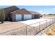 Attached three car garage with large parking area and perimeter fencing at 2031 Silver St, Pahrump, NV 89048