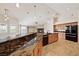 Open kitchen features granite countertops, stainless appliances, and seamless flow into the living area at 2031 Silver St, Pahrump, NV 89048