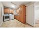 Laundry room featuring built in cabinets, washer and dryer, and tile floors at 2031 Silver St, Pahrump, NV 89048