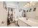 Stylish bathroom featuring modern fixtures, a patterned shower curtain, and decorative wall art at 2050 W Warm Springs Rd # 3624, Henderson, NV 89014