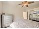 Comfortable bedroom featuring a stylish dresser, mirrored closet doors, and soft lighting at 2050 W Warm Springs Rd # 3624, Henderson, NV 89014