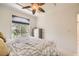 Cozy bedroom with a large window overlooking lush greenery, offering a serene retreat at 2050 W Warm Springs Rd # 3624, Henderson, NV 89014