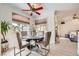 Inviting dining area with a round table, stylish chairs, and natural lighting at 2050 W Warm Springs Rd # 3624, Henderson, NV 89014