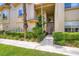 Inviting entryway with neat landscaping leads to the front door of the townhome at 2050 W Warm Springs Rd # 3624, Henderson, NV 89014