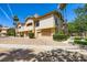 Charming exterior view of the townhome featuring well-maintained landscaping and private garages at 2050 W Warm Springs Rd # 3624, Henderson, NV 89014